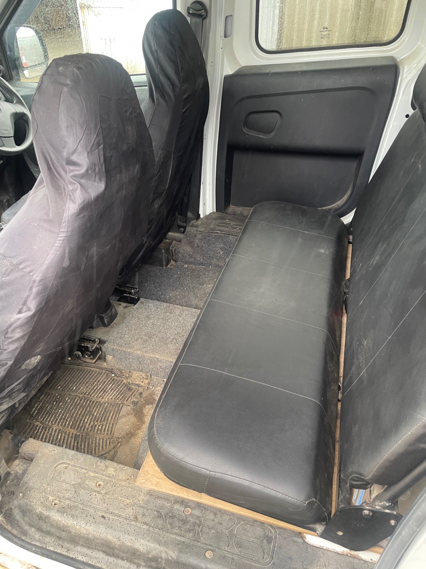 Dirty work van interior before an M&M Deluxe valet