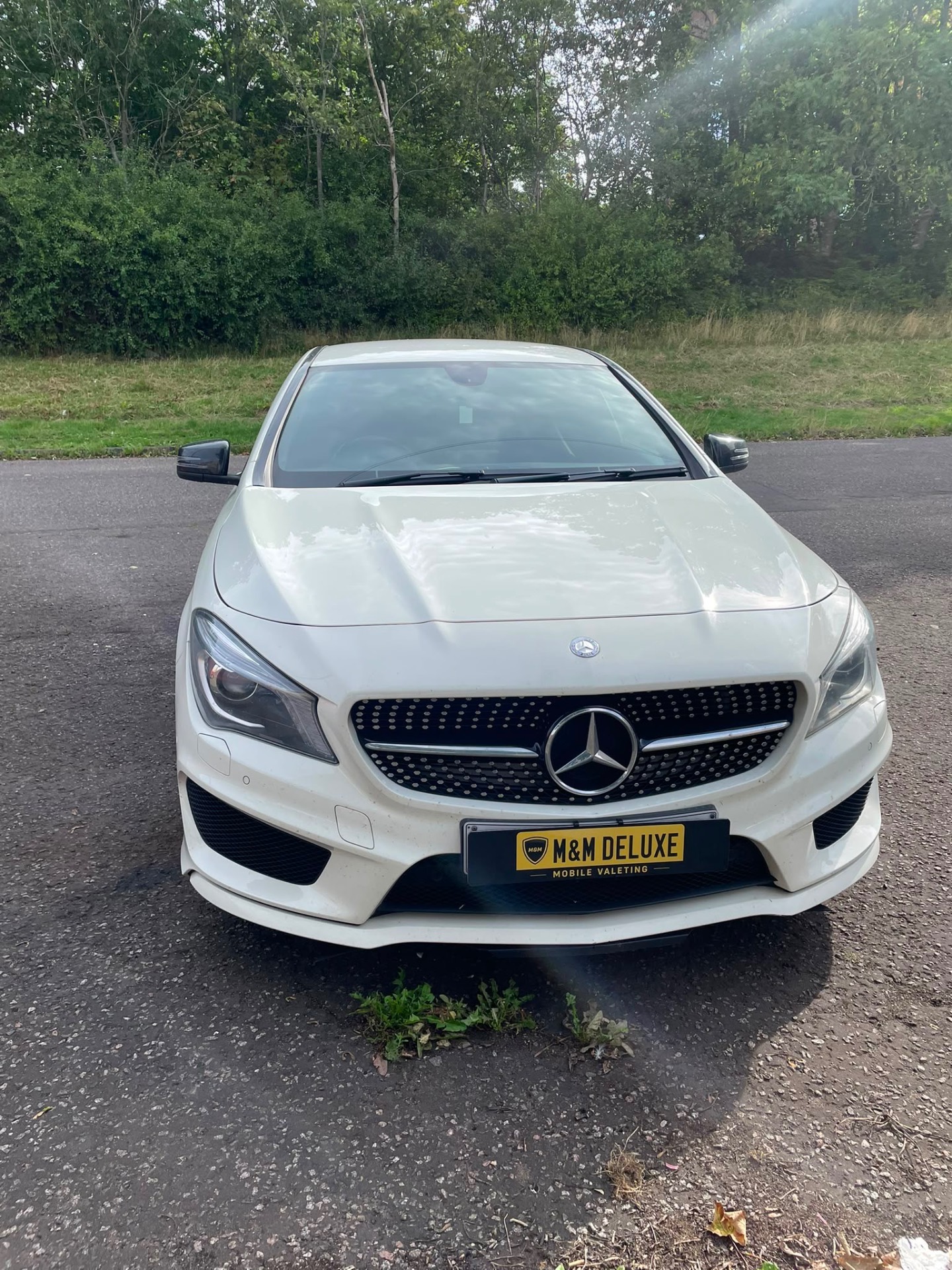 White Mercedes CLA finished with M&M Deluxe plate